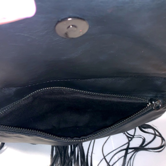 BCBGeneration black clutch bag. Snaps closed hanging leather strings. 2 zippers - Picture 9 of 9
